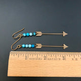 Brass Arrow Long Earrings With Blue Bead Accent