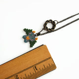 Beaded Dragon In Green And Gray With Celtic Infinity Charm