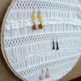 Decorative White Fabric Earring Hanger In Use 