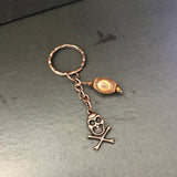 Copper Color Skull And Crossbones With Agate Accent Keychain