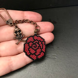 Black And Red Rose With Copper Tone Skull Charm