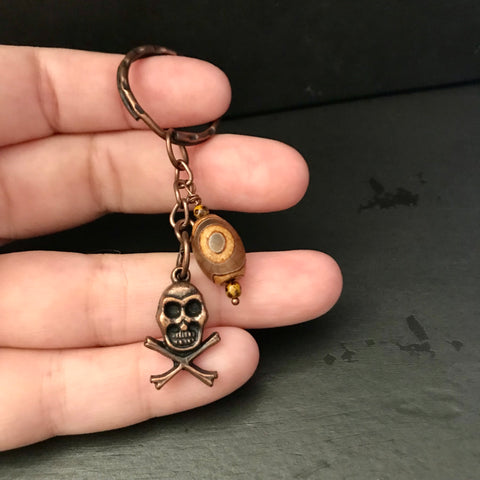 Copper Color Skull And Crossbones With Agate Accent Keychain